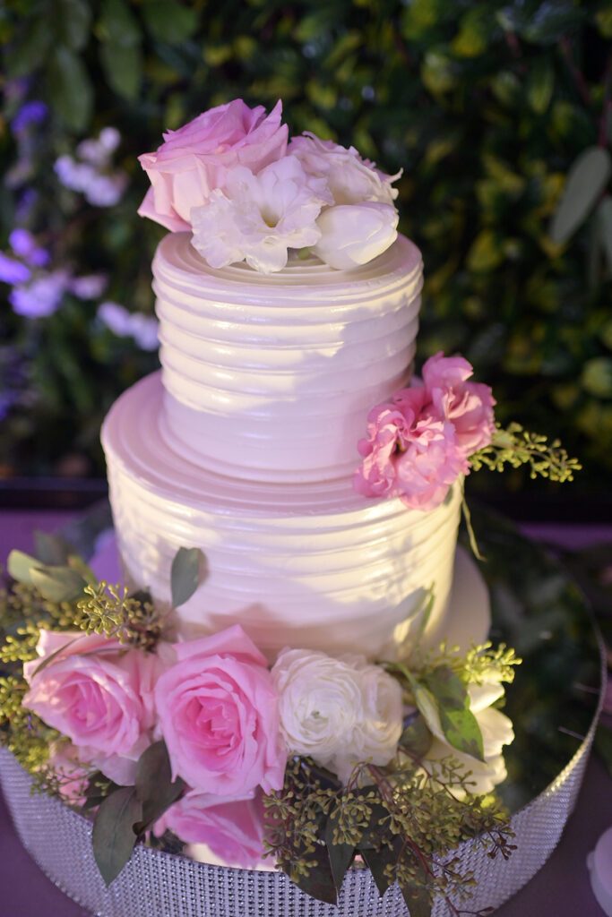 wedding cake with pink flowers